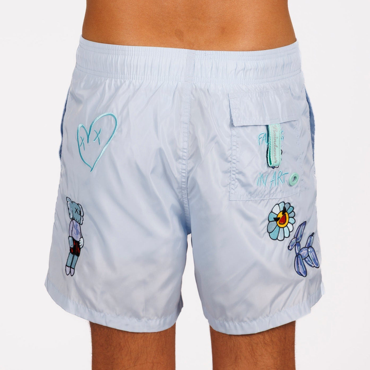 Light blue swim shorts back view with illustrated graphic