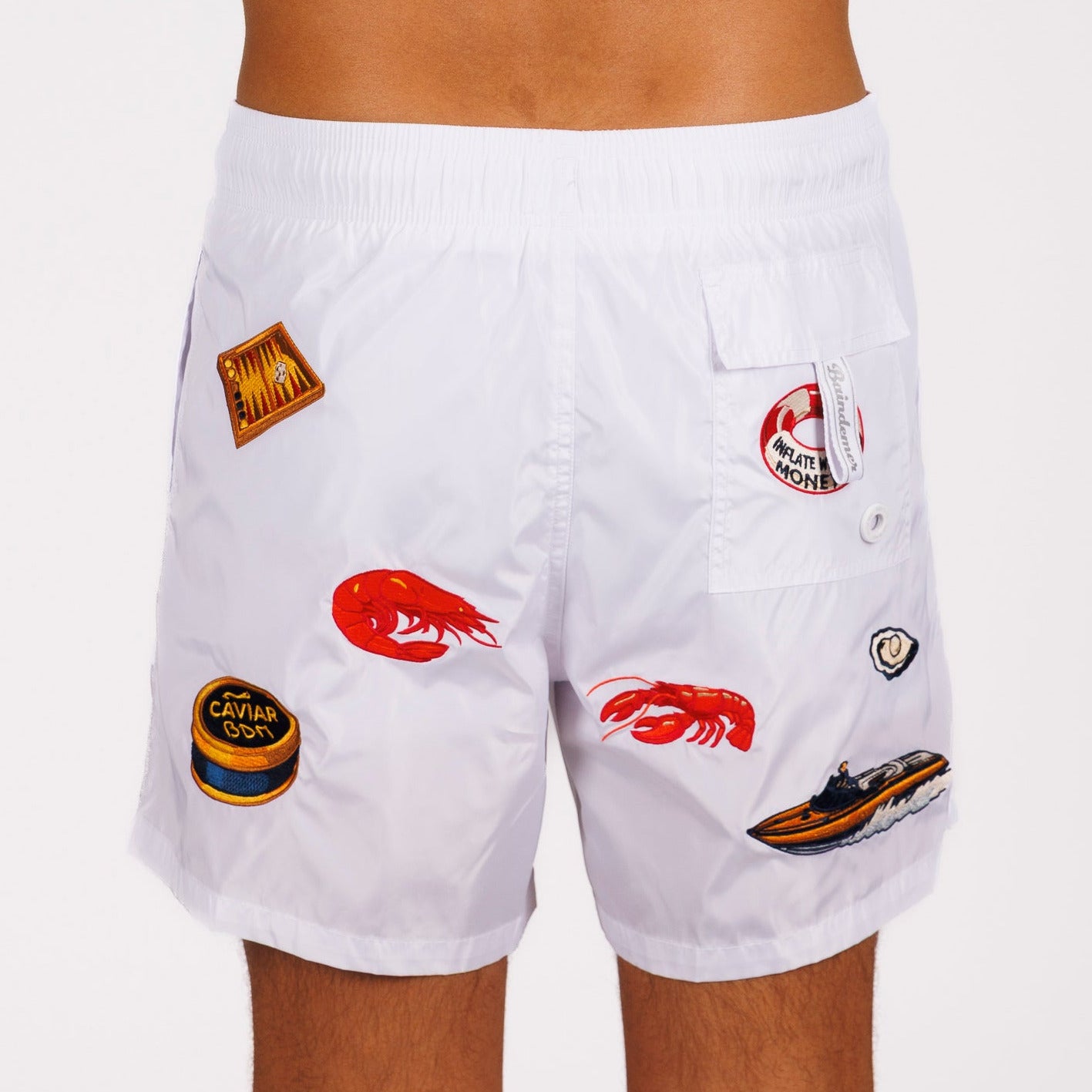 White swim shorts back view with illustrated graphic