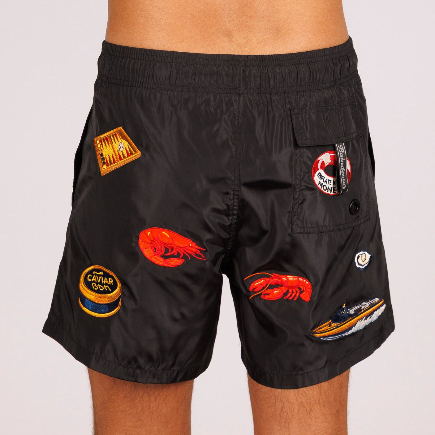 Black swim shorts back view with illustrated graphic