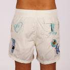 Off-white swim shorts back view with illustrated graphic