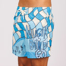 Blue swim shorts side view with all-over illustrated graphic and text