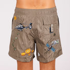 Khaki swim shorts back view with illustrated graphic