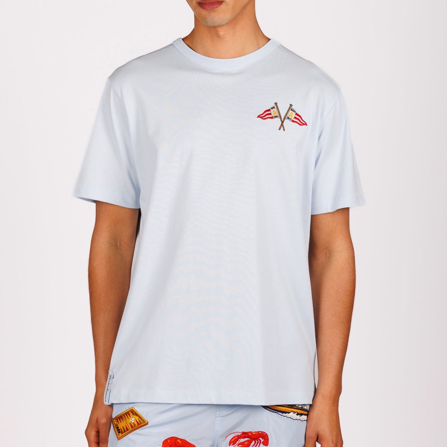 Light blue T-shirt front view with illustrated graphic