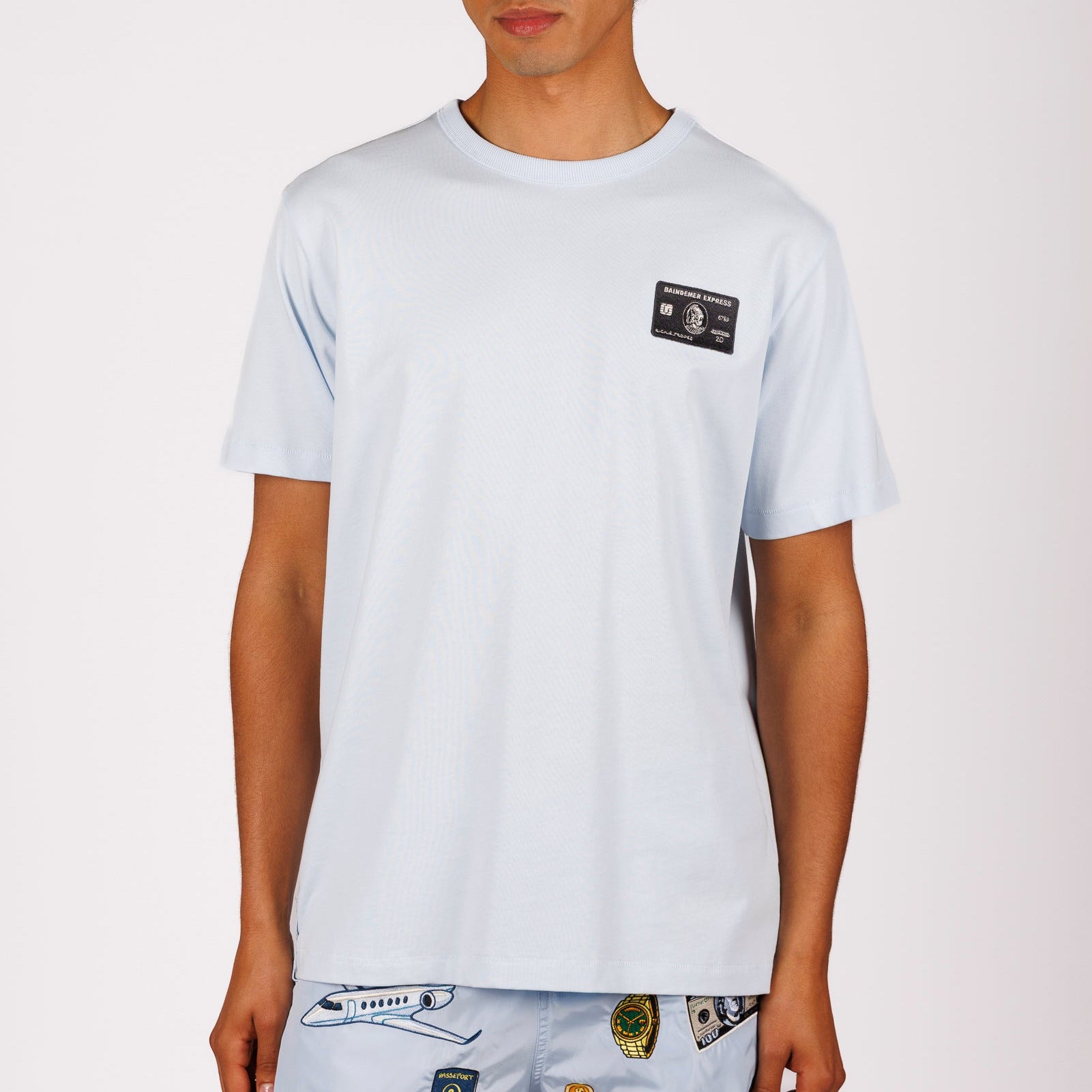 Light blue T-shirt front view with illustrated graphic