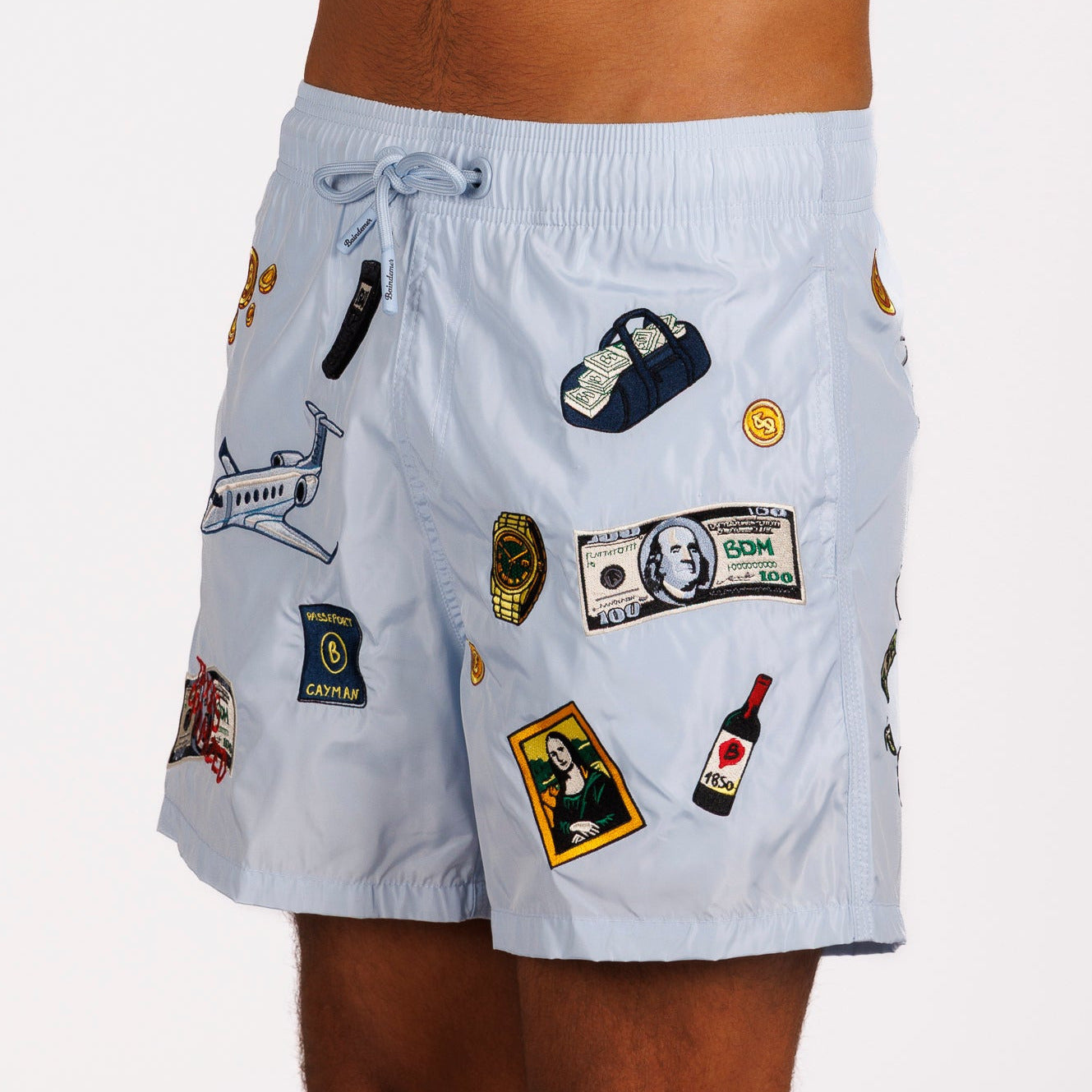 Light blue swim shorts side view with illustrated graphic