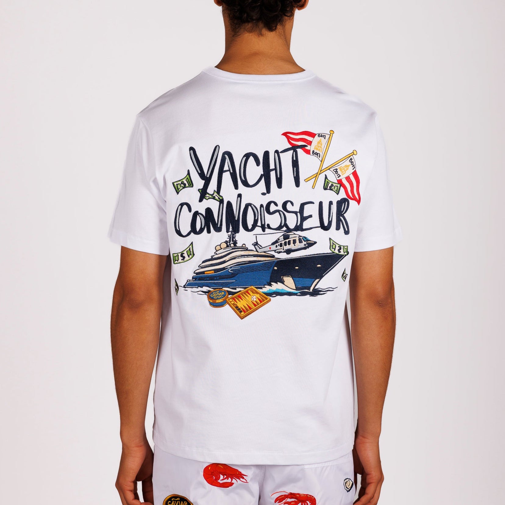 White T-shirt back view with illustrated graphic and “Yacht connoisseur” text