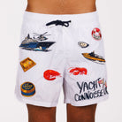 White swim shorts front view with illustrated graphic and “Yacht connoisseur” text