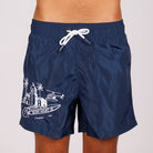 Navy blue swim shorts front view with illustrated graphic and “BDM Sport 18” text